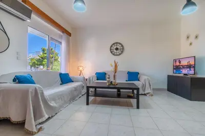 a living room with a couch and a table at Mike's House in Kremasti near the Beach Rhodes in Kremasti