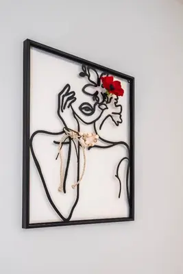 a framed picture of a heart with a flower at Calliope's Rhodes City Comfort in Rhodes Town