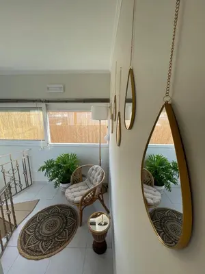 a living room with a mirror on the wall at Summer Diamond in Kremasti