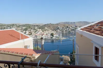 a view of a harbor from the balcony of a house at Aeneo Studio 2 in Symi