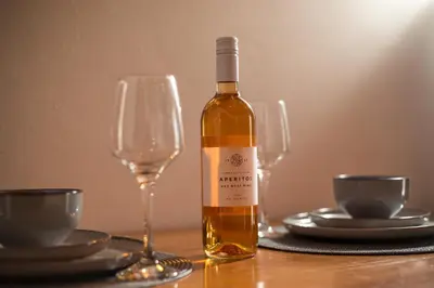 a bottle of wine sitting on a table with glasses at Rhodes VistaPeak Retreat in Áyios Isídhoros