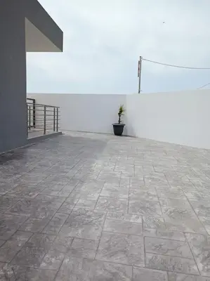 a potted plant sitting on top of a patio at Traounou Bay villa in Afantou