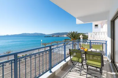a balcony with a view of the beach at Artoria Apartment 1 Groundfloor in Haraki