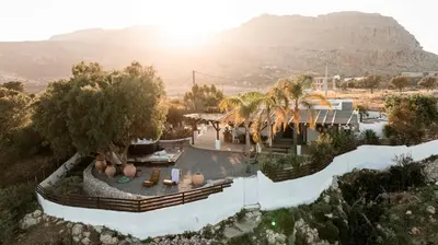 an aerial view of a house with a mountain in the background at Ninémia Sea living in Archangelos