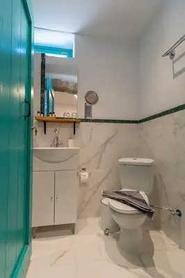 a bathroom with a toilet and a sink at Casa Ifestou in Rhodes Town