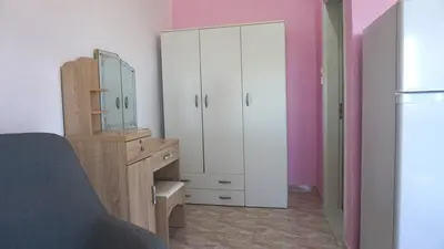a bedroom with a dresser and a mirror at Summer scoop studio by EvaGstays in Faliraki
