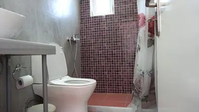 a bathroom with a toilet and a shower at Summer scoop studio by EvaGstays in Faliraki