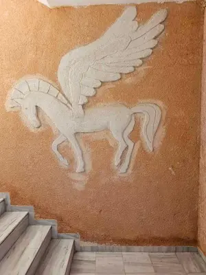 a painting of a horse on the side of a wall at Farkia Studios by Aegean in Faliraki