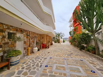 a stone walkway in a building with a tree at Farkia Studios by Aegean in Faliraki