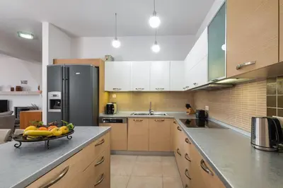a kitchen with a bowl of fruit on the counter at Villa Serenity in Ialyssos