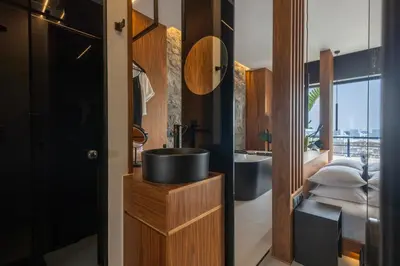 a bathroom with a sink and a mirror at The Suite in Rhodes Town