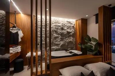 a bathroom with a sink and a bath tub at The Suite in Rhodes Town