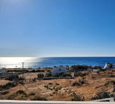 a view of the ocean from a house at Almira Beach House in Kiotari