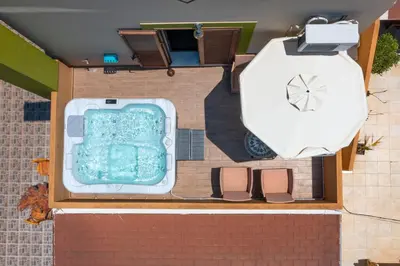 an overhead view of a swimming pool next to a gallon at Asimenis Cottages in Kattavía