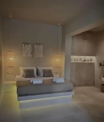 a bedroom with a bed with two towels on it at Hacienda tradition&relax in Afantou