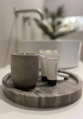 a wooden tray with two cups on a table at Hacienda tradition&relax in Afantou