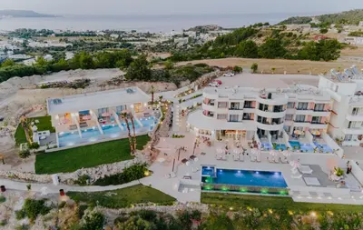 an aerial view of the hotel and the villas at The Palms Concept Hotel Adults Only 16 Plus in Faliraki