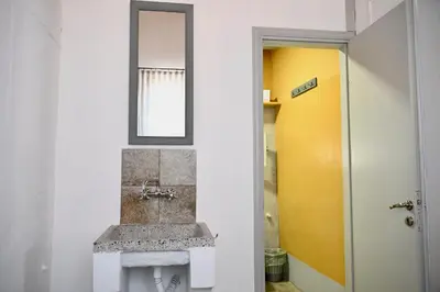 a bathroom with a sink and a mirror at PENELOPE garden house old town in Rhodes Town