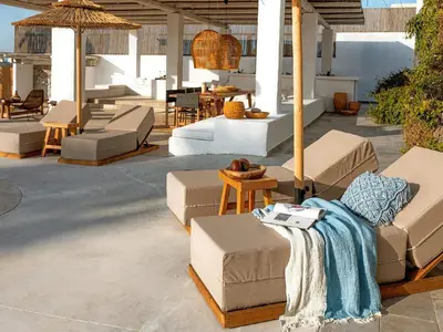 a patio with couches and chairs and a table at Exquisite Rhodes Villa Villa Boho Chic 6 Bedrooms Private Pool in Lachania