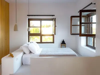 a white bedroom with a bed and a window at Exquisite Rhodes Villa Villa Boho Chic 6 Bedrooms Private Pool in Lachania