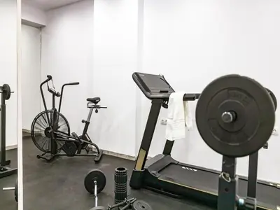 a room with a gym with a barbell and a bike at Exquisite Rhodes Villa Villa Boho Chic 6 Bedrooms Private Pool in Lachania
