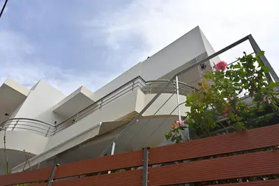 a modern house with a glass facade at Mika's B luxury House near Faliraki in Kalithies