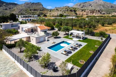 an aerial view of a house with a swimming pool at Eternity Villa Kolympia in Kolimbia