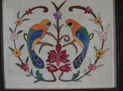 a painting of two birds sitting on flowers at Lindos Traditional House in Rhodes Town