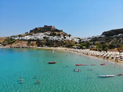 a group of people in the water at a beach at Villa Marina - Glystra Beach in Kiotari