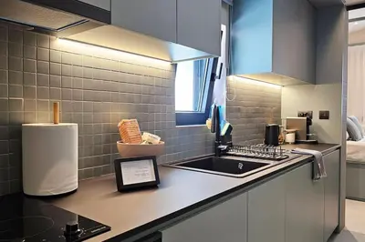 a kitchen with a sink and a counter top at MINT in Rhodes Town