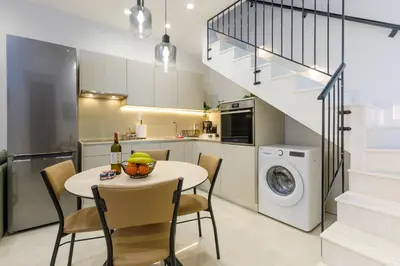 a kitchen and dining room with a table and chairs at Lindian Villas in Líndos
