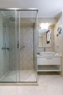 a bathroom with a shower and a sink at Lindian Villas in Líndos