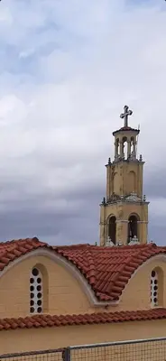 a church with a cross on top of a roof at Isaias house in Rhodes Town