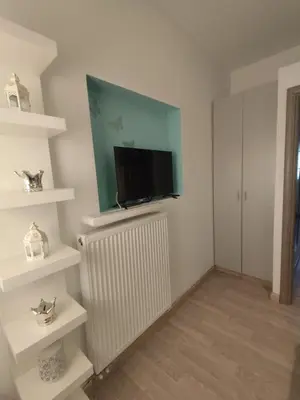 a living room with a flat screen tv on a radiator at Isaias house in Rhodes Town