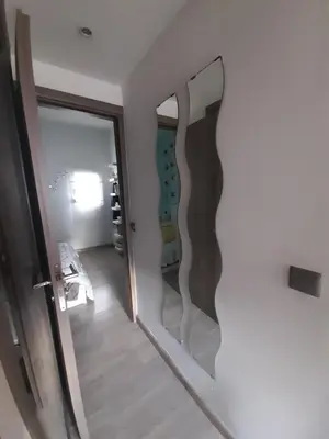 a mirror on a wall next to a room at Isaias house in Rhodes Town