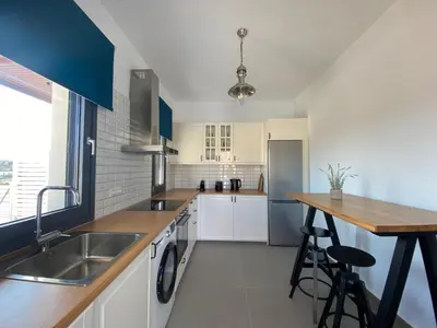 a kitchen with a sink and a counter at Pefkos Vista Luxury Villas in Pefki Rhodes