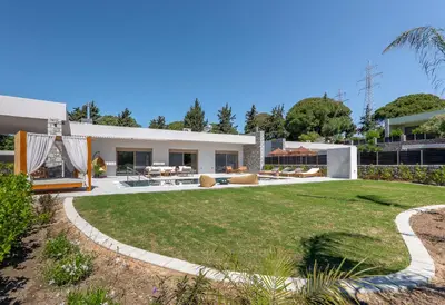 a house with a large yard with a lawn at Emerald & Ruby Villas in Asgourou