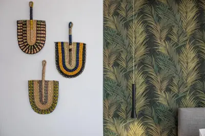 a couple of hooks hanging on a wall at 3K Rodo Rooms in Faliraki