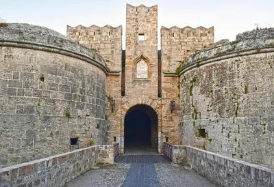 an entrance to a castle with a large brick wall at Majestic Marble Retreat in Rhodes Town
