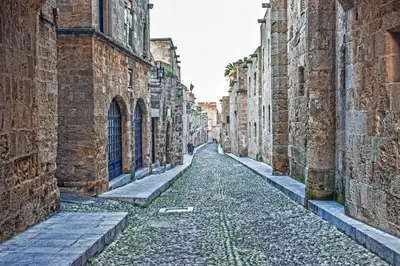an alley between two buildings in an old city at Majestic Marble Retreat in Rhodes Town