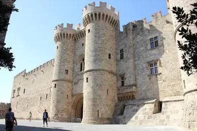 a castle with people standing in front of it at Majestic Marble Retreat in Rhodes Town