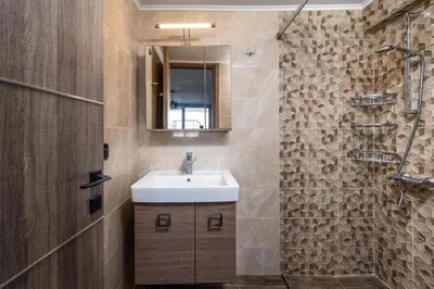 a bathroom with a sink and a shower at Psychedelia Beach House in Gennadi