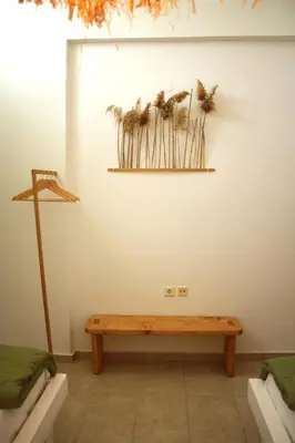 a room with a wooden bench on the wall at Villa FLORA in Kattavía