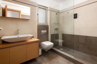 a bathroom with a toilet and a sink and a shower at Cielo Blu villa in Soroni