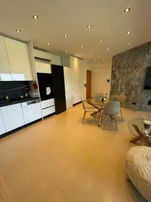 a large kitchen and dining room with a table and chairs at Lihi's Sea View in Rhodes in Rhodes Town