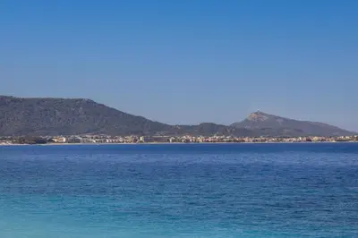 a large body of water with mountains in the background at Lihi's Sea View in Rhodes in Rhodes Town