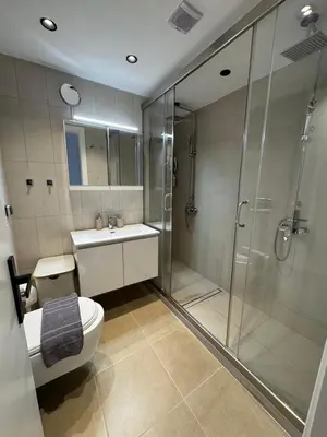 a bathroom with a shower and a toilet and a sink at Lihi's Sea View in Rhodes in Rhodes Town