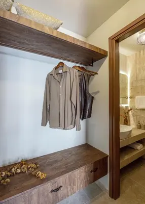 a coat hanging on a shelf in a bathroom at Spanish Knights Inn in Rhodes Town