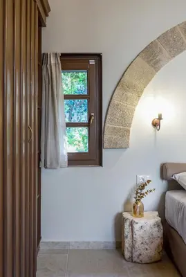 a bedroom with a bed and a window at Spanish Knights Inn in Rhodes Town