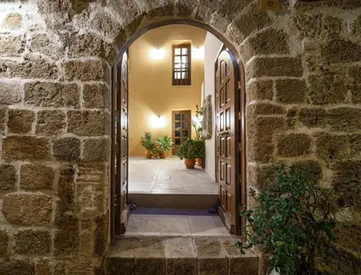 an archway leading to a hallway in a stone building at Spanish Knights Inn in Rhodes Town